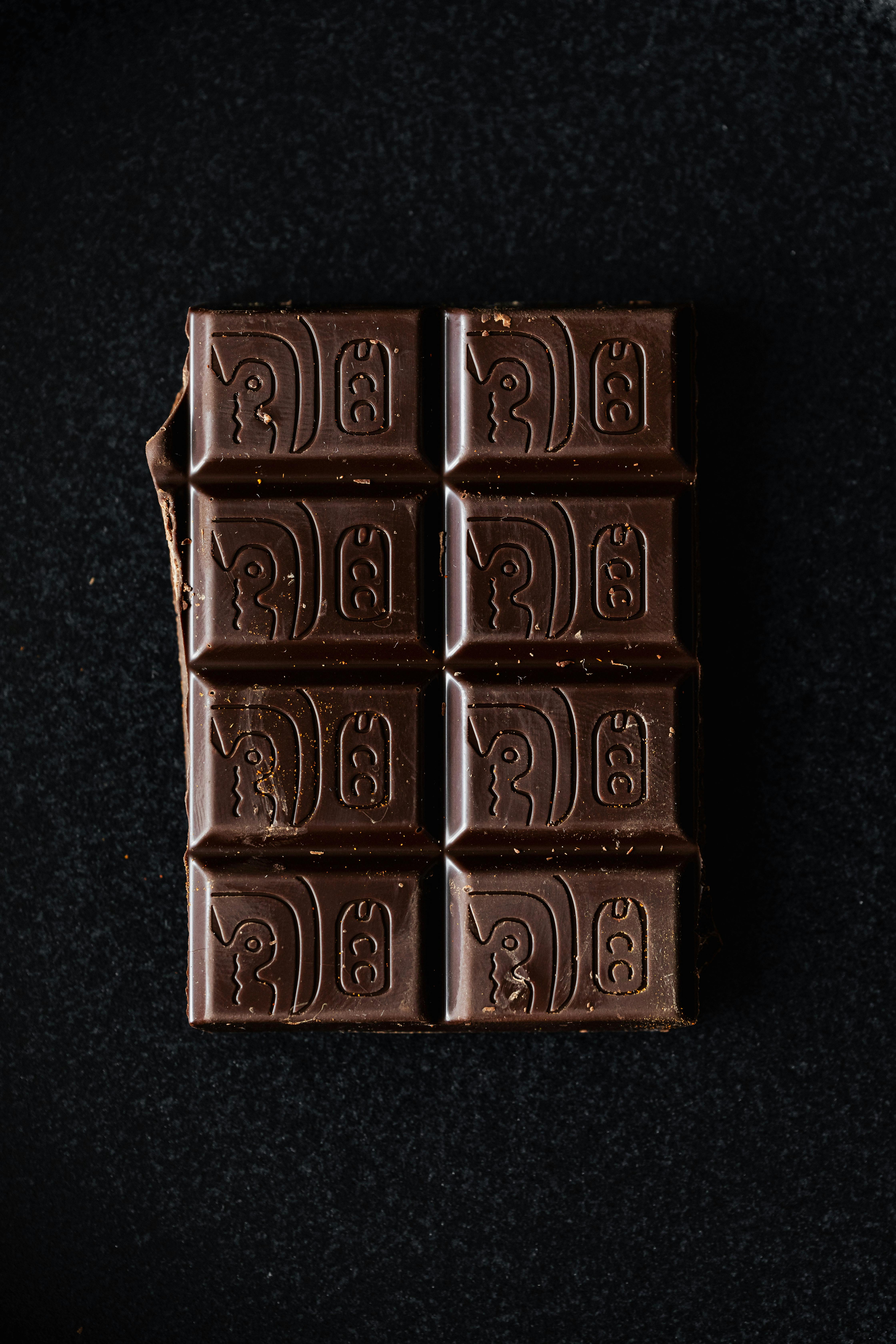 Dark chocolate on black background